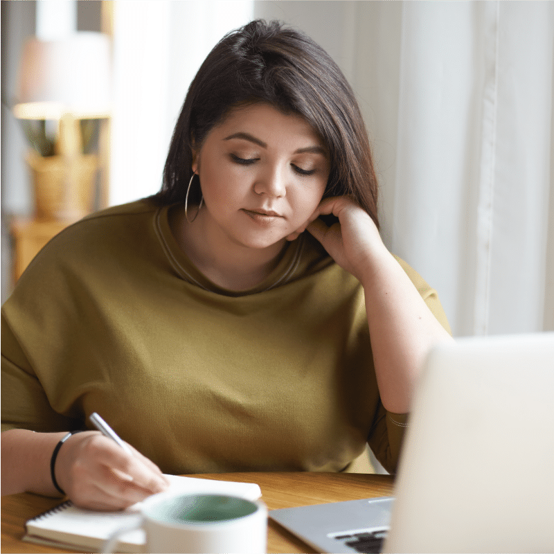 Woman recording her progress with weight loss