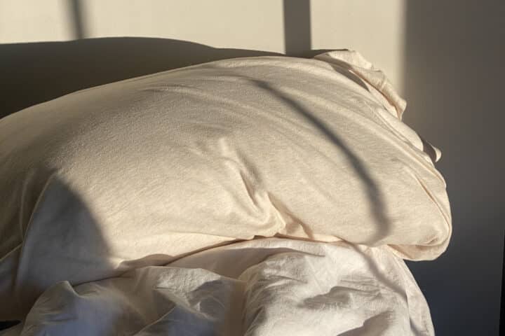 image of shadows on an unmade bed